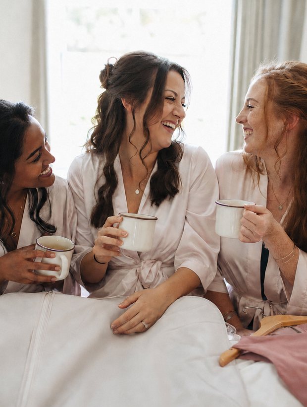 Bridesmaids in robes on the morning of the wedding