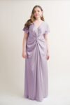 curvy model wearing Camilla bridesmaid dress in lilac.