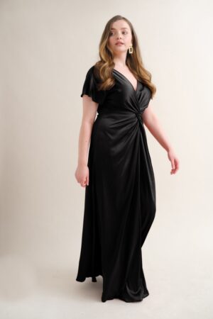 curvy model wearing Camilla bridesmaid dress in black.
