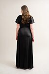 curvy model wearing Camilla bridesmaid dress in black.