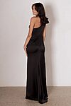 Model wearing the Kiko bridesmaid dress by Tania Olsen in light satin, featuring a one-shoulder neckline with tiered flute sleeve, draped waist, and A-line skirt with high-leg split.