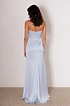 Model wearing the Layana bridesmaid dress by Tania Olsen in light satin, featuring a strapless corset bodice, draped waist, and A-line skirt with high-leg split.