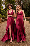 Tania Olsen Marseille bridesmaid dress in wine, featuring a corset-style bodice, V-neckline, and A-line skirt with thigh-high split, photographed in studio lighting.