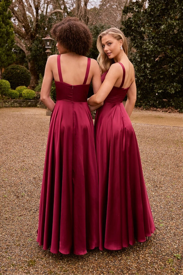 Marseille Bridesmaid Dress by Tania Olsen Back Tania Olsen Marseille bridesmaid dress in wine, featuring a corset-style bodice, V-neckline, and A-line skirt with thigh-high split, photographed in studio lighting.