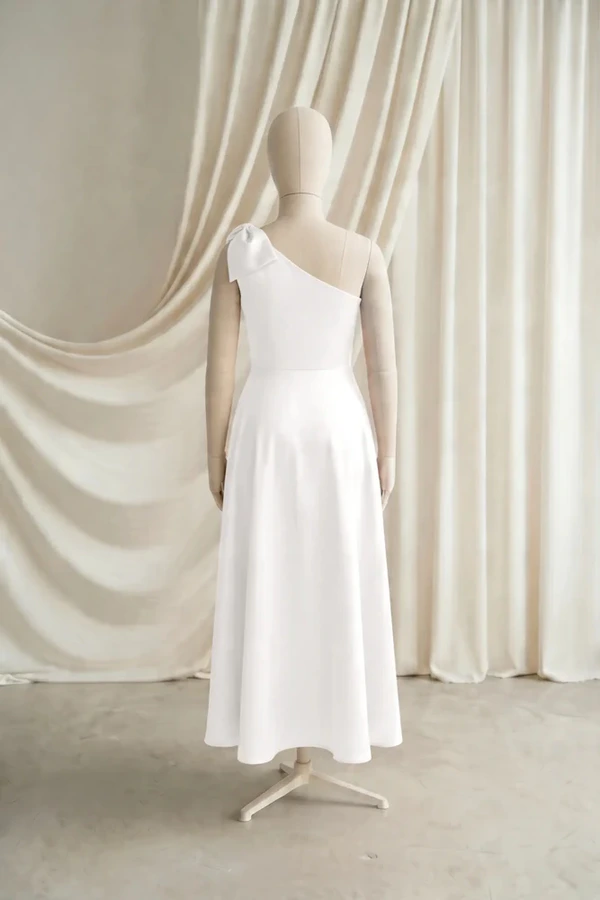 Mara Junior Bridesmaid Dress by TH&TH – Neutral – Ivory – Back Mara junior bridesmaid dress by TH&TH in Ivory, full-length back view