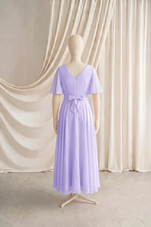 Phoebe Junior Bridesmaid Dress by TH&TH – Purple – Lilac Mist – Back Phoebe junior bridesmaid dress by TH&TH in Lilac Mist, full-length back view