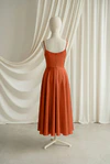 Tilly junior bridesmaid dress by TH&TH in Terracotta, full-length back view