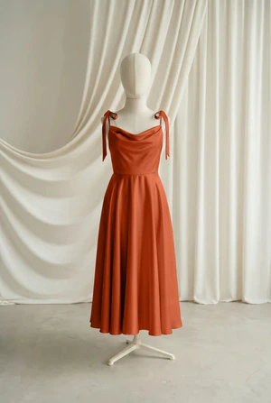 Tilly junior bridesmaid dress by TH&TH in Terracotta, full-length front view